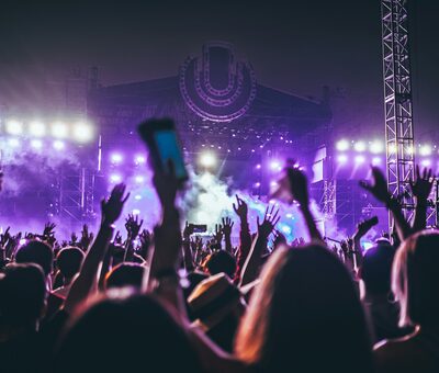 A crowd holding phones up